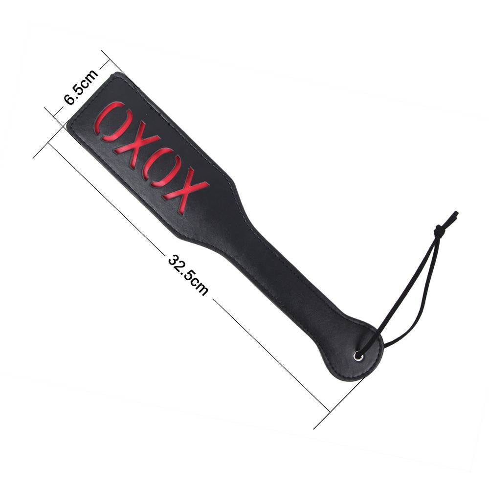 Black and red BDSM whip with 'oxox' imprint
