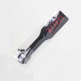 Packaged black and red BDSM whip