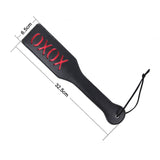 Black and red BDSM whip with 'oxox' imprint