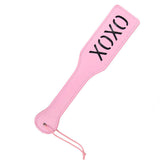 Pink leather BDSM whip with 'xoxo' imprint